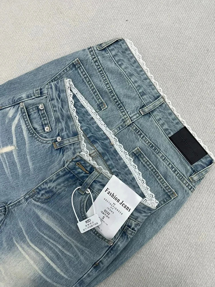 Light-wash straight-leg plus-size jeans laid flat; lace waistband and back pockets