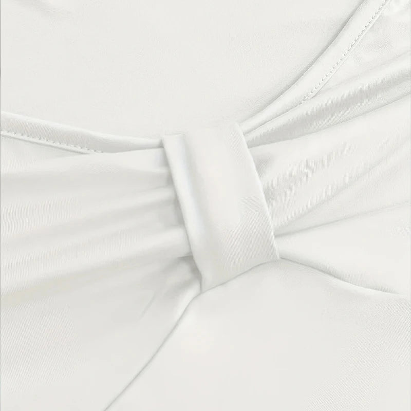 Close-up of white fabric with a bow