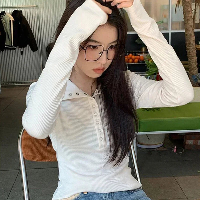 White long-sleeve ribbed knit shirt with studded V-neck collar and button front
