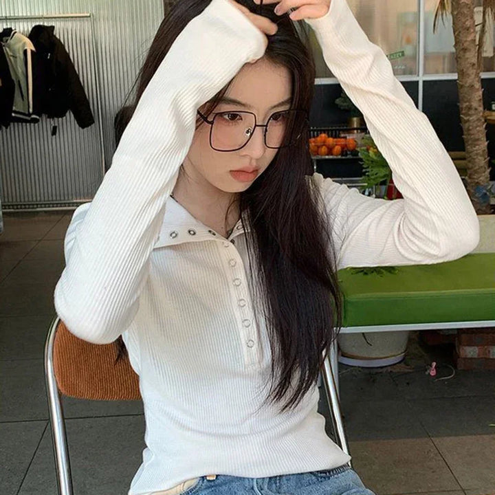 White long-sleeve ribbed knit shirt with studded V-neck collar and button front