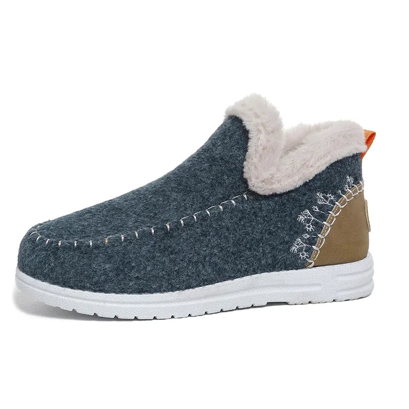 Dark blue felt slip-on ankle snow loafer with white fleece-lined collar and white sole