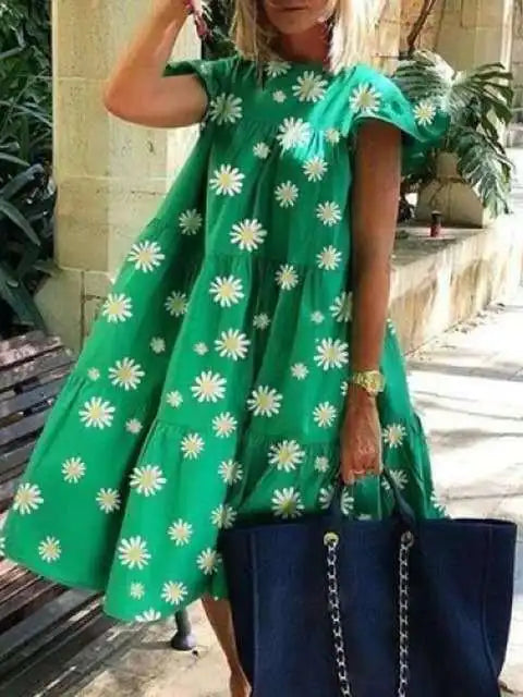 Green midi dress with daisy print, puff sleeves, and tiered ruffle skirt