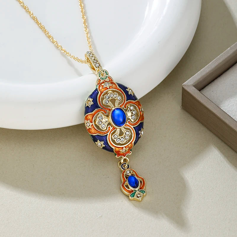 Decorative necklace with a gold chain and intricate pendant