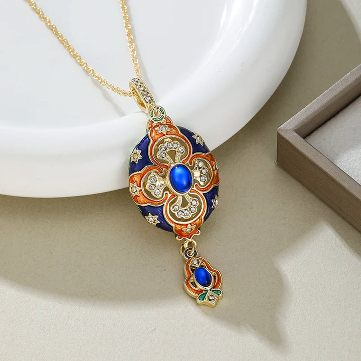 Decorative necklace with a gold chain and intricate pendant