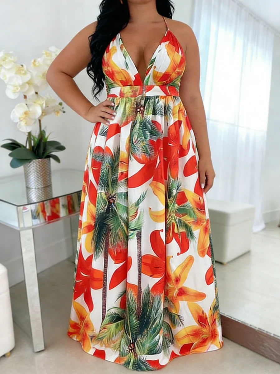 Woman wearing a colorful floral dress in a bright room.