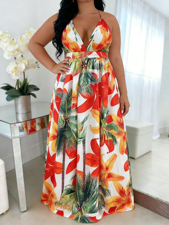 Woman wearing a colorful floral dress in a bright room.