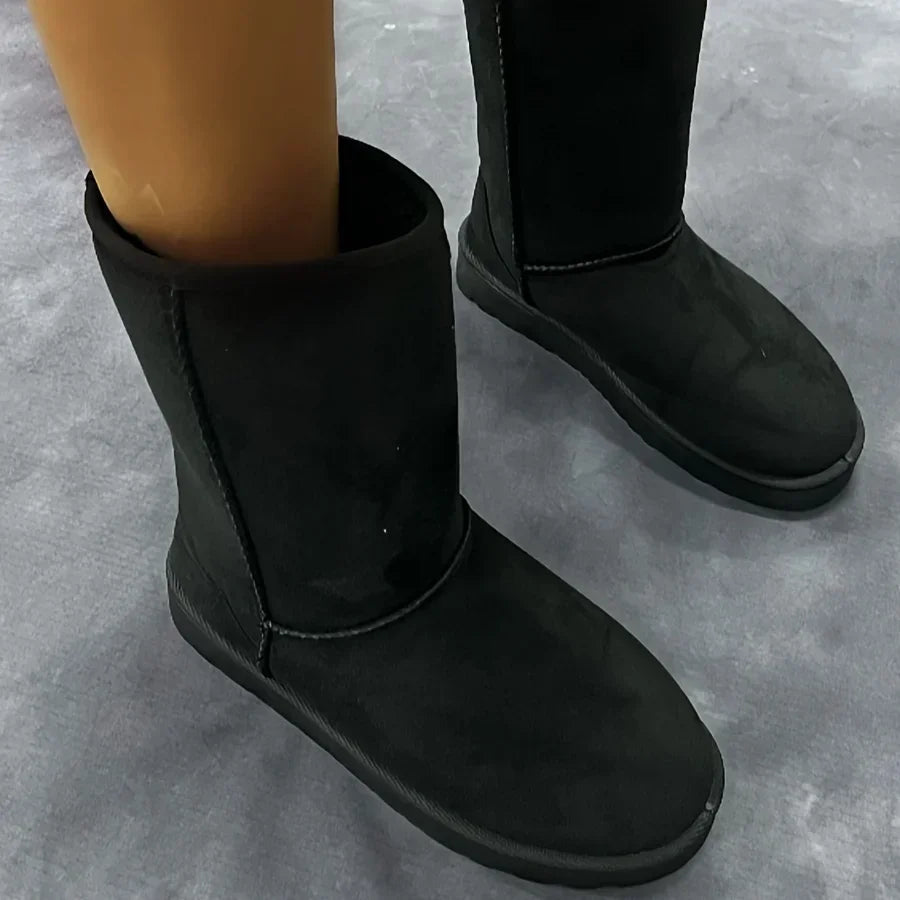 Black corduroy mid-calf platform snow boots with thick sole, ankle view
