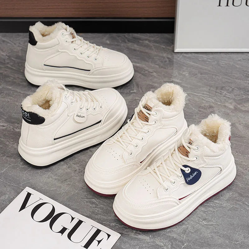 Pair of white lace-up platform winter sneakers with plush fur lining and thick sole