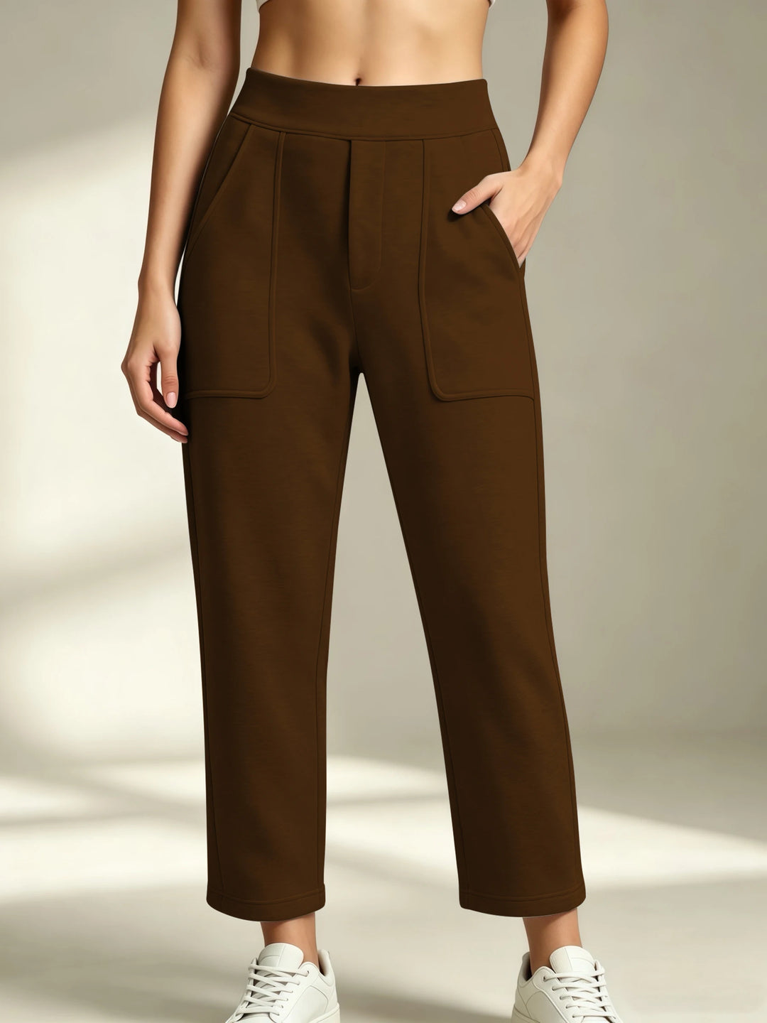 Women's brown straight-leg sweatpants with an elastic waist and front patch pockets