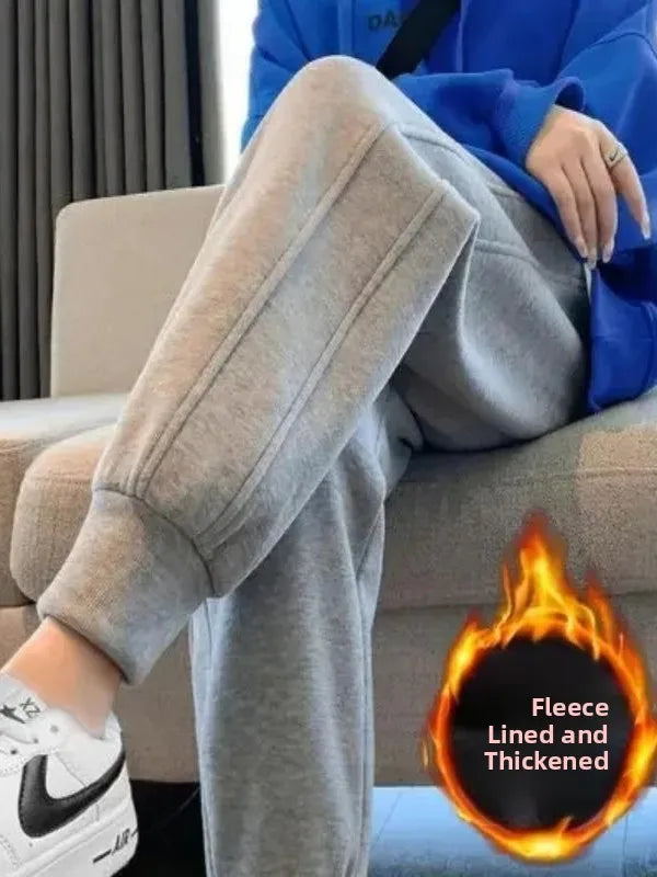 Women's Gray Fleece-Lined Cuffed Joggers Styled With A Blue Jacket, Seated View