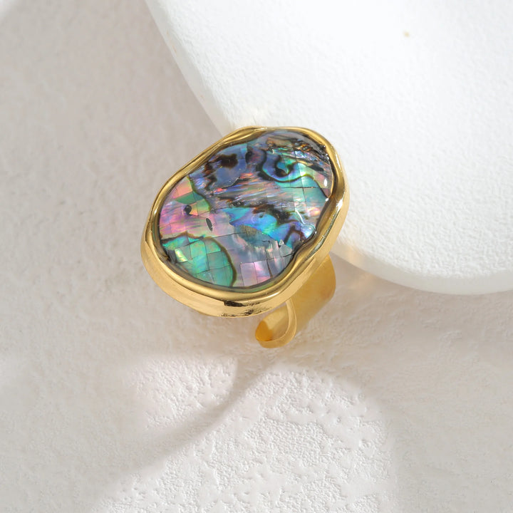 Gold open ring with oval abalone shell inlay, iridescent purple-blue, split band