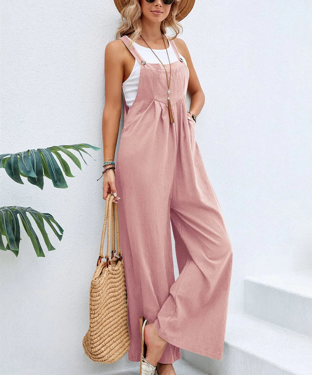Blush pink sleeveless jumpsuit with adjustable straps and relaxed wide-leg silhouette