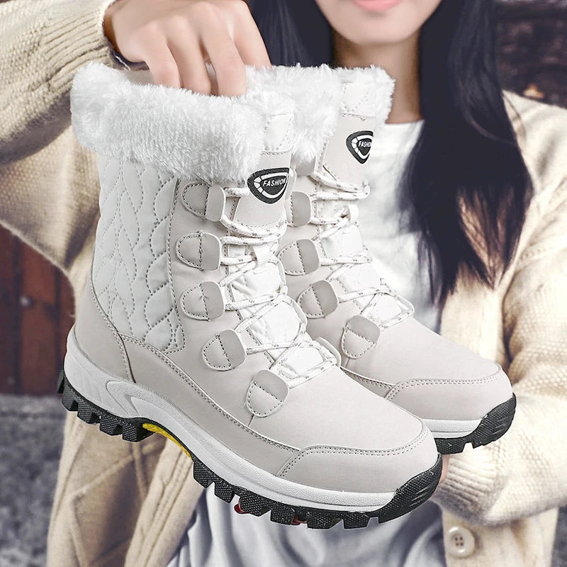 Women's white mid-calf lace-up snow boots with thick fleece lining and grippy outsole
