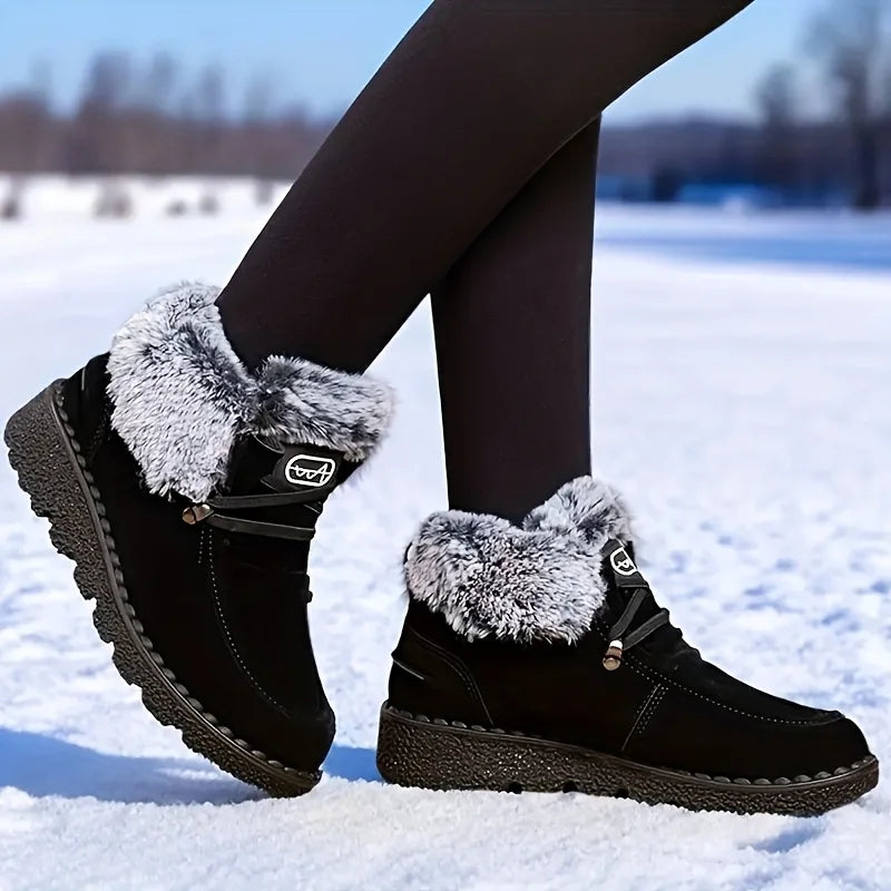 Women's black lace-up snow boots with fuzzy cuffs and textured lug sole
