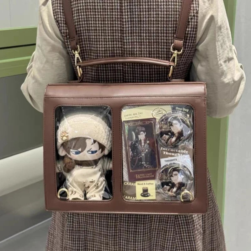 Brown crossbody bag with transparent window front and adjustable shoulder strap