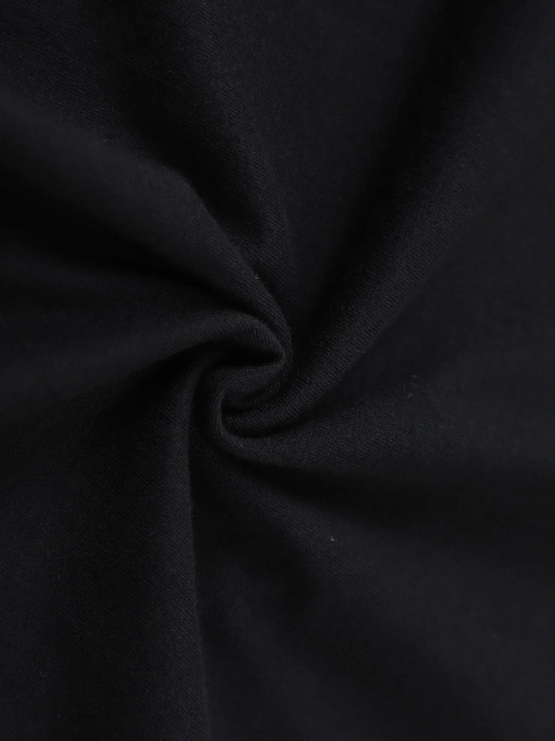 Black cotton jersey fabric close-up with soft drape
