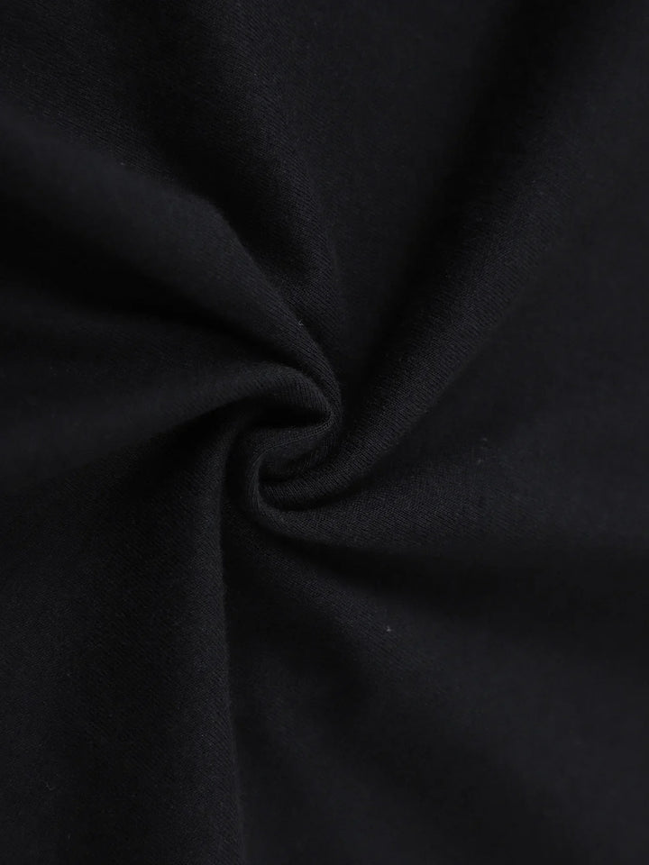 Black cotton jersey fabric close-up with soft drape
