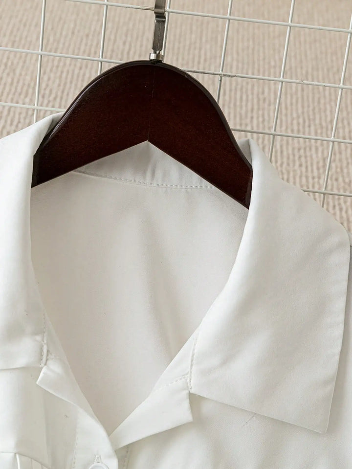 White turn-down collar button-up shirt, front neckline and placket close-up