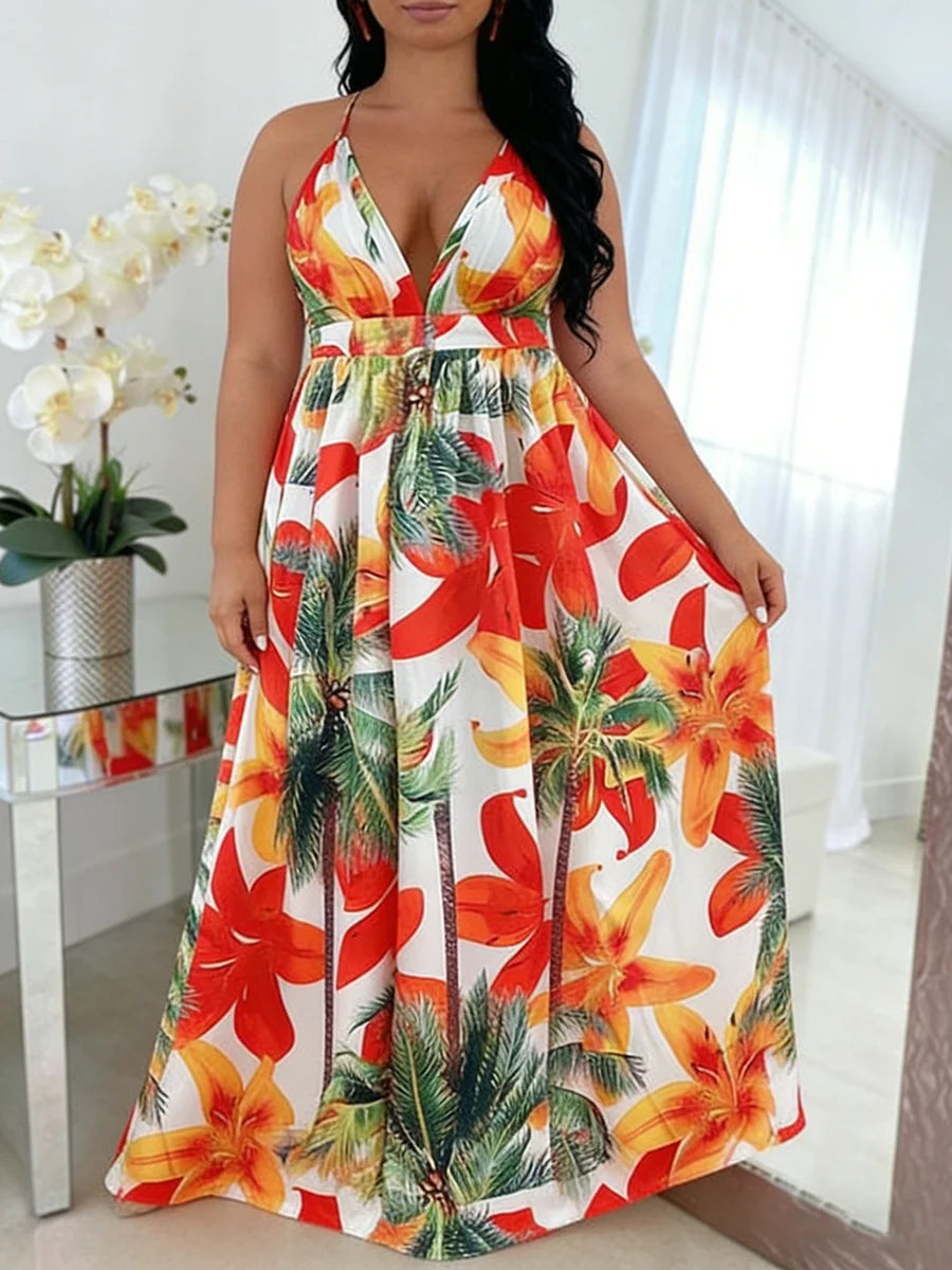 Woman wearing a tropical floral dress in a bright room with white curtains.