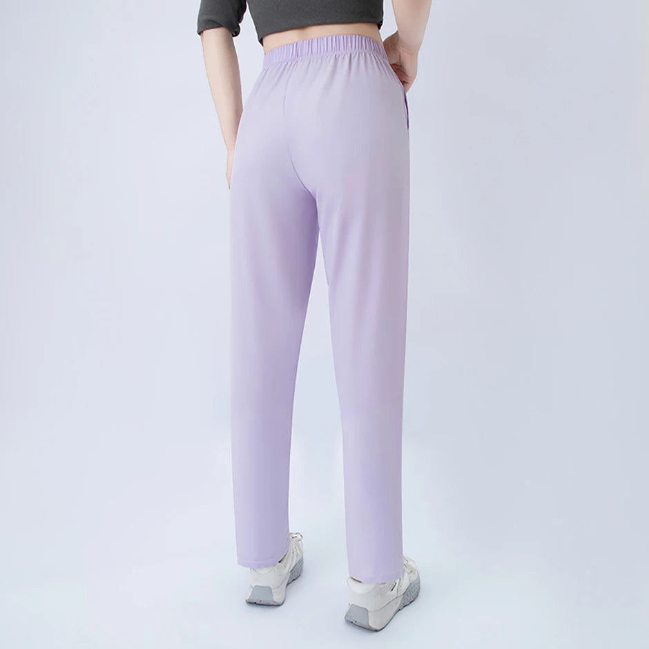 Lavender wide-leg pocket pants with elastic waist, back view