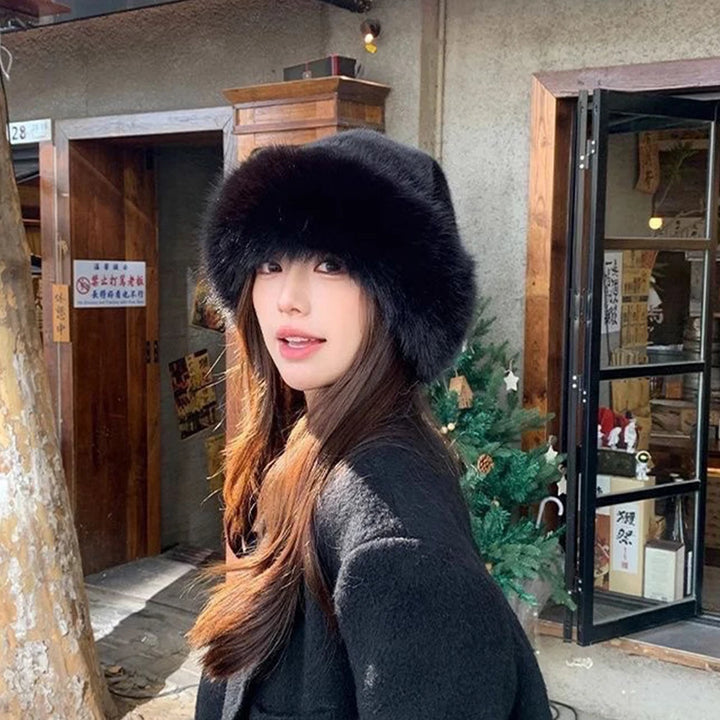 Warm plush faux fur hat, black rounded dome with thick furry brim on model