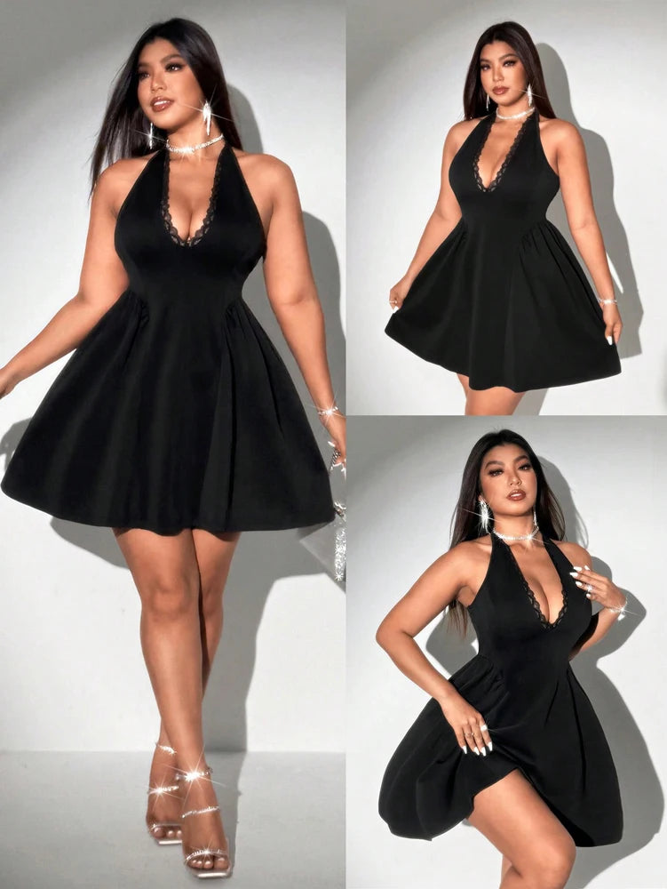 Black dress worn by a model on a white background