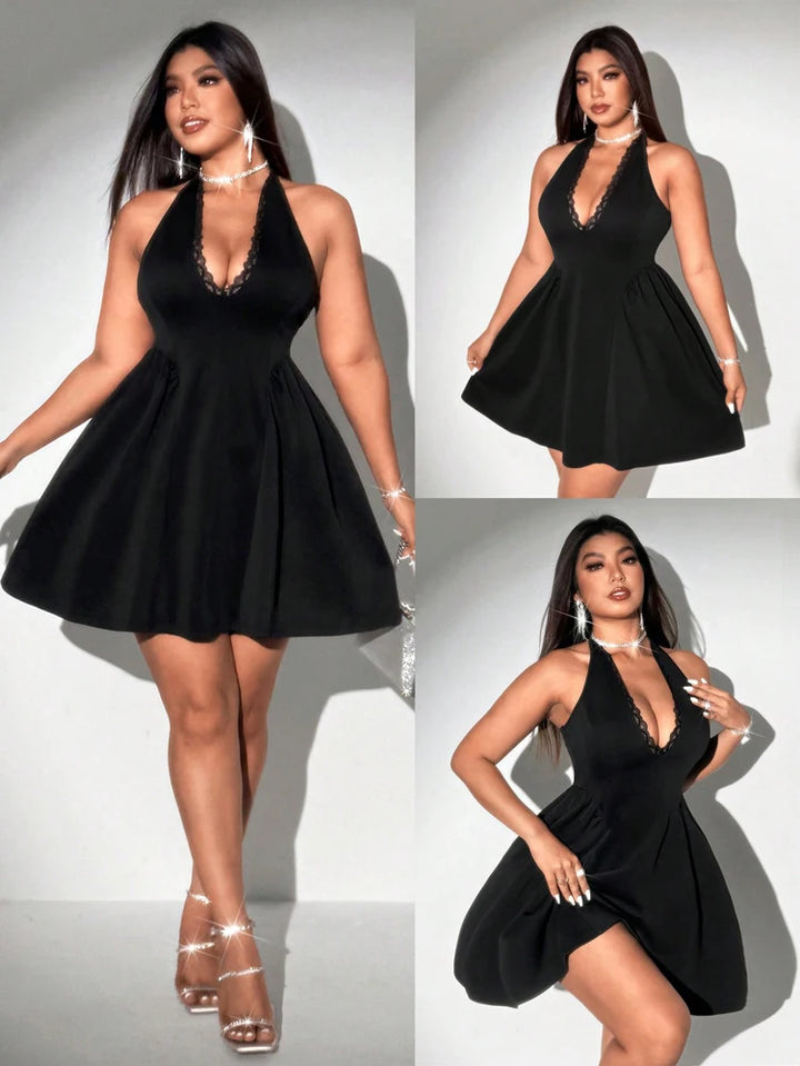 Black dress worn by a model on a white background