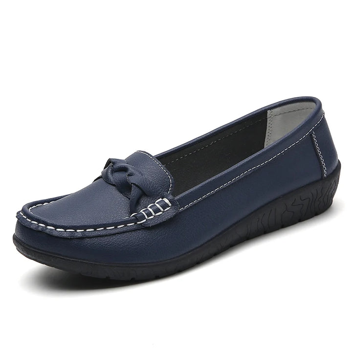 Navy blue loafer shoe on a white background