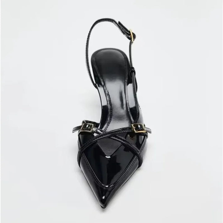 Women’s black pointed-toe slingback heels with open cross-strap and stiletto heel
