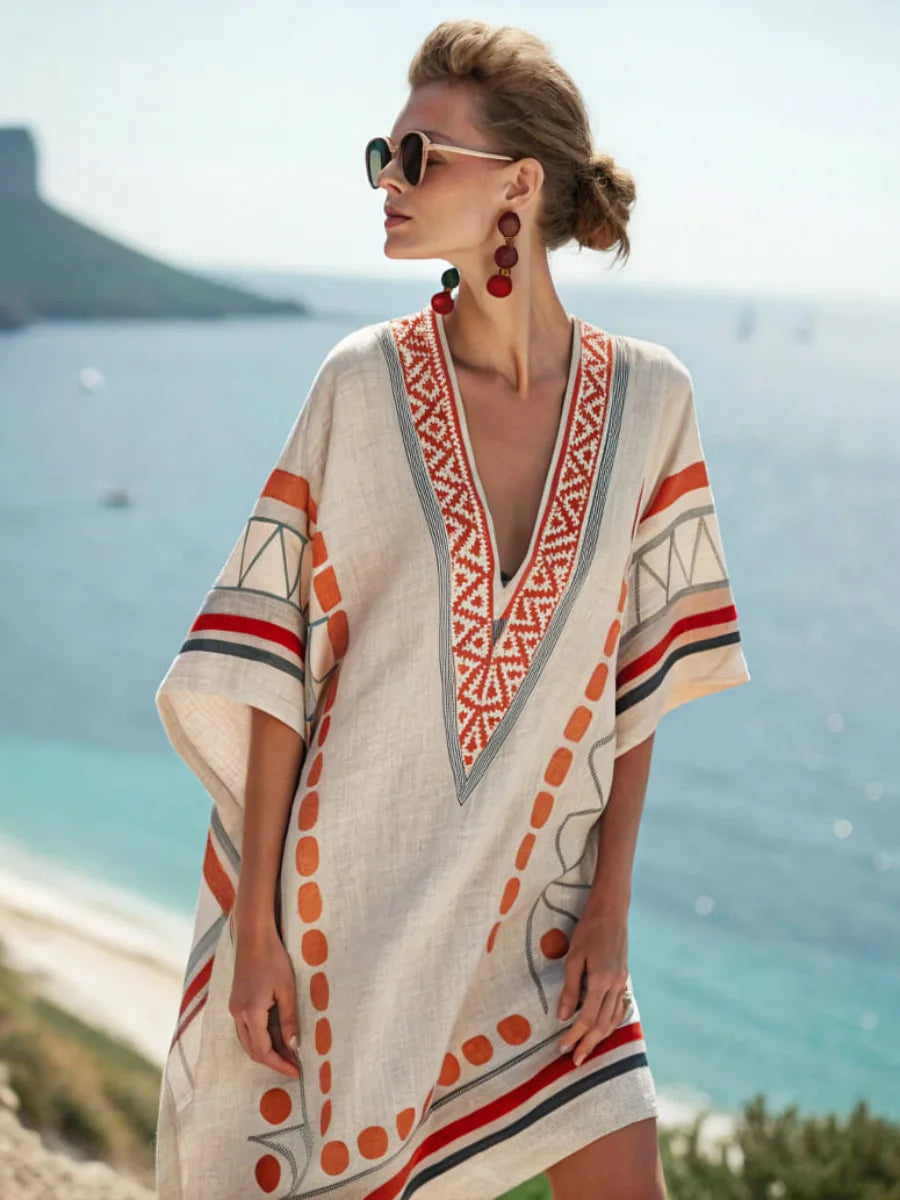 White V-neck mini dress with red embroidered trim and orange dot stripe print, short sleeves