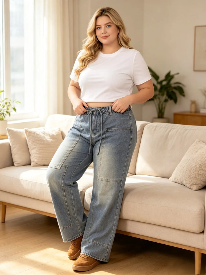 Light blue denim cargo jeans with drawstring waist, wide leg, and front seam details