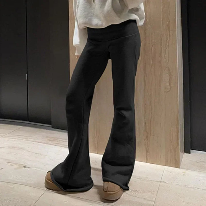 Black bootcut dress pants with hidden elastic waist, flared leg opening