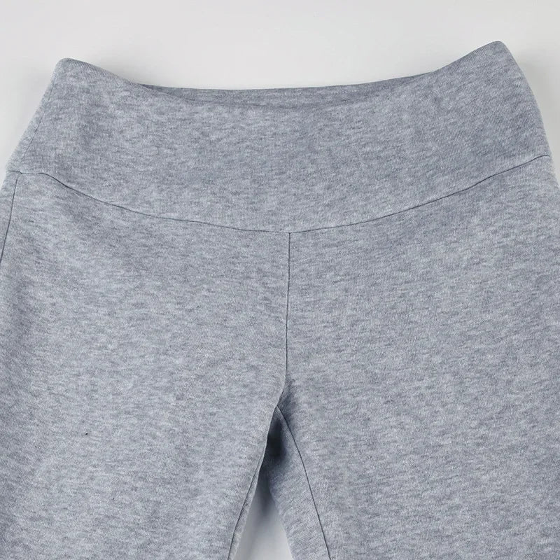 Gray dress pant waistband and front seam detail on slim bootcut legs