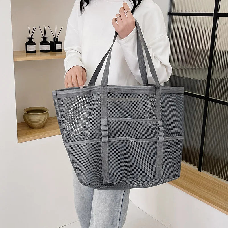 Gray sheer mesh tote bag with open top, wide handles, and front organizer panel