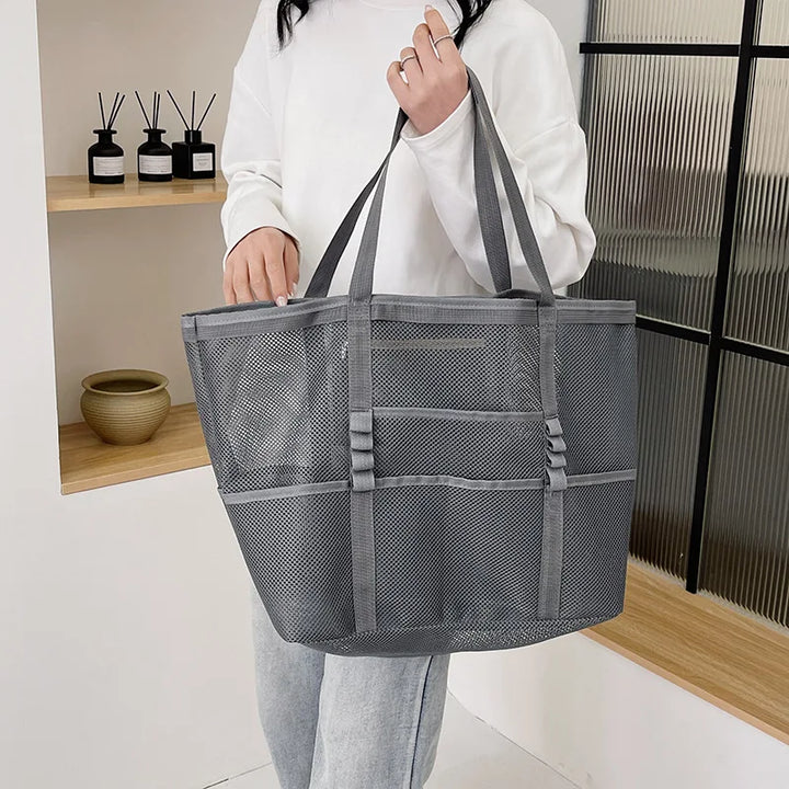 Gray sheer mesh tote bag with open top, wide handles, and front organizer panel