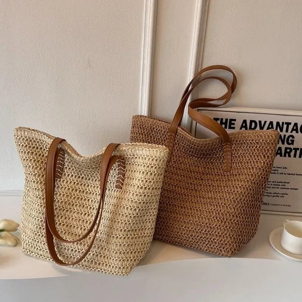 Two woven bags with brown handles on a light surface.