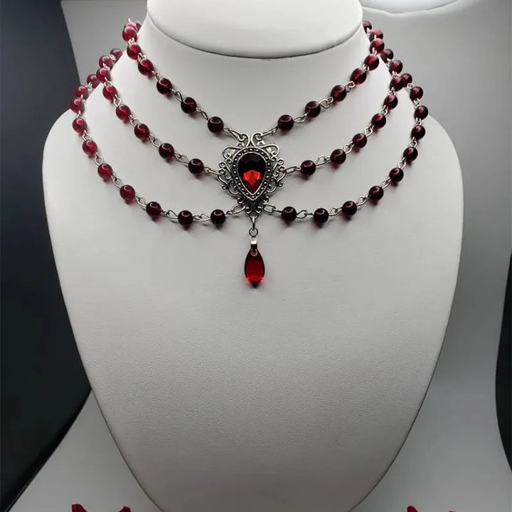 Gothic beaded necklace with dark red beads, ornate teardrop pendant, red drop charm