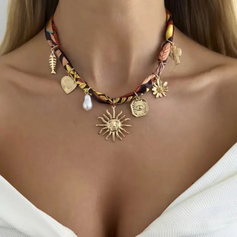 Boho sunflower heart pendant necklace with charm sun and small gold-tone charms