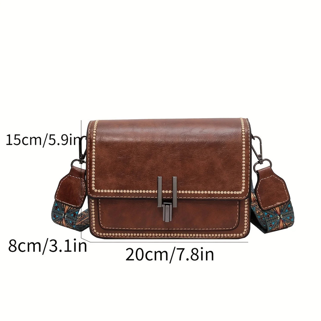 Mini crossbody bag in brown with flap lock and beaded edge trim, patterned side straps