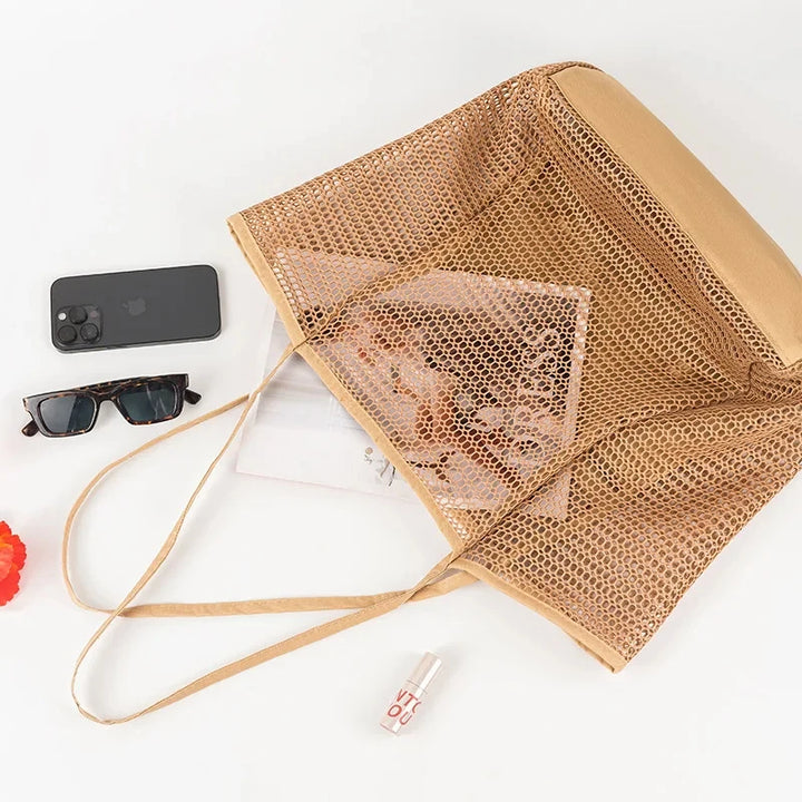 Foldable mesh tote in brown opened flat, showing inner zipped pocket