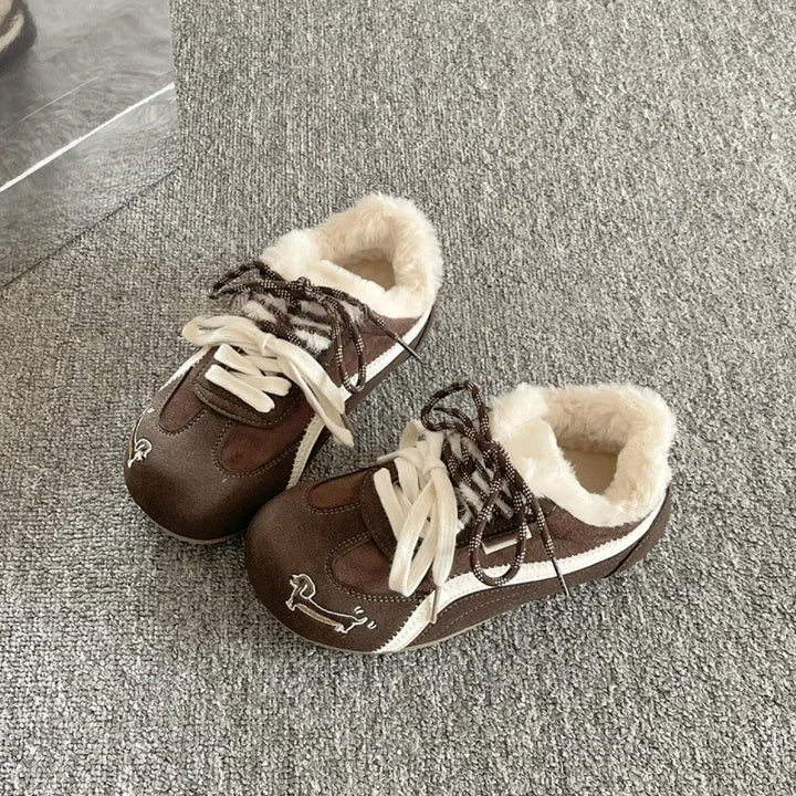 Brown lace-up platform sneakers with faux fur collar and white rubber sole detail