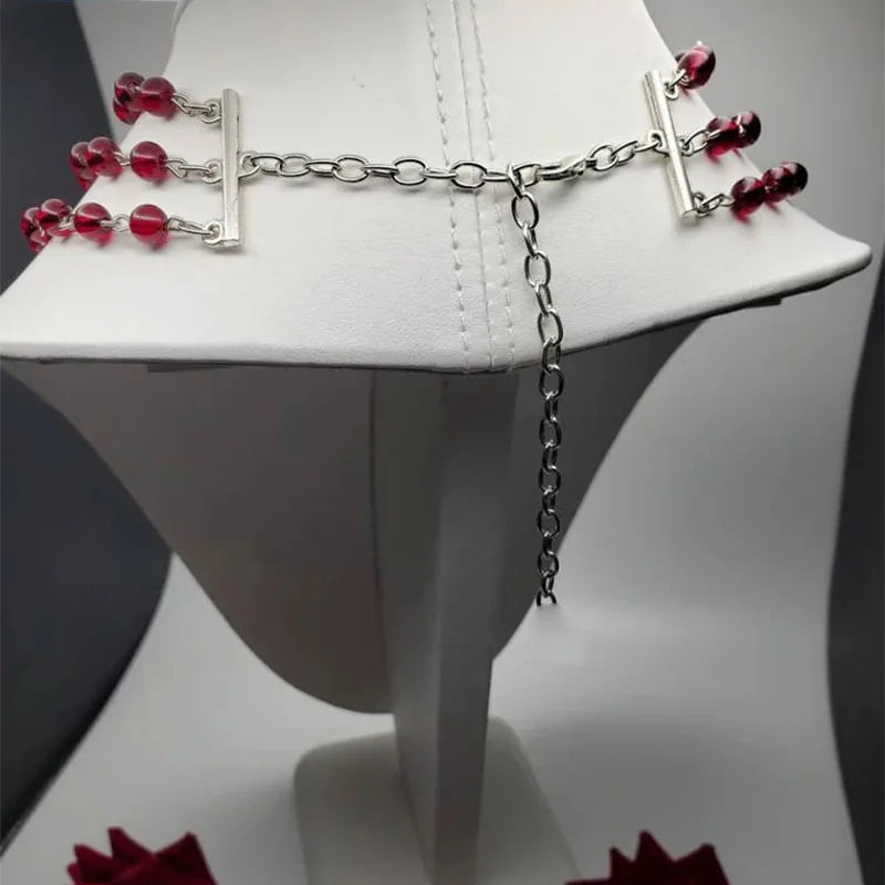Necklace clasp and chain extender with dark red bead strands and silver tone links
