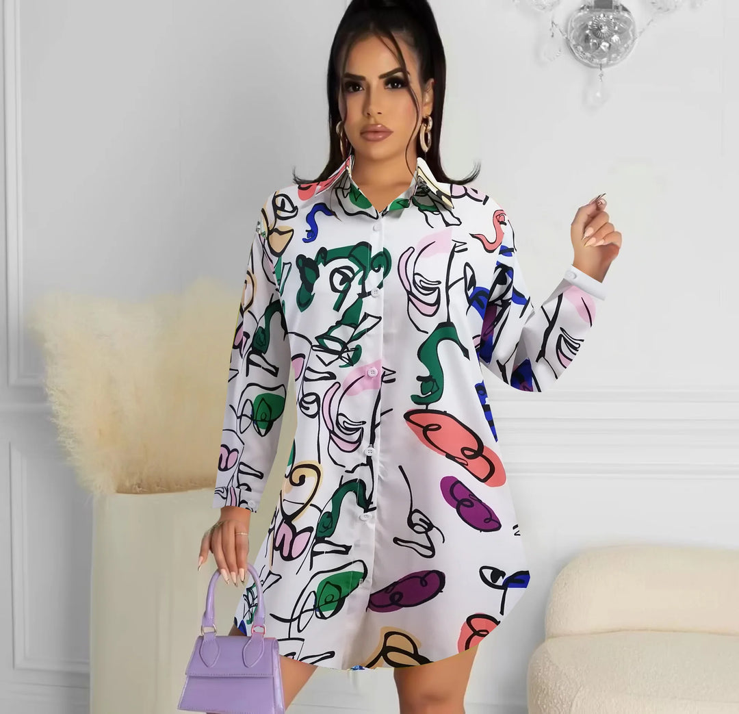 Woman wearing a colorful dress with abstract patterns in a room.