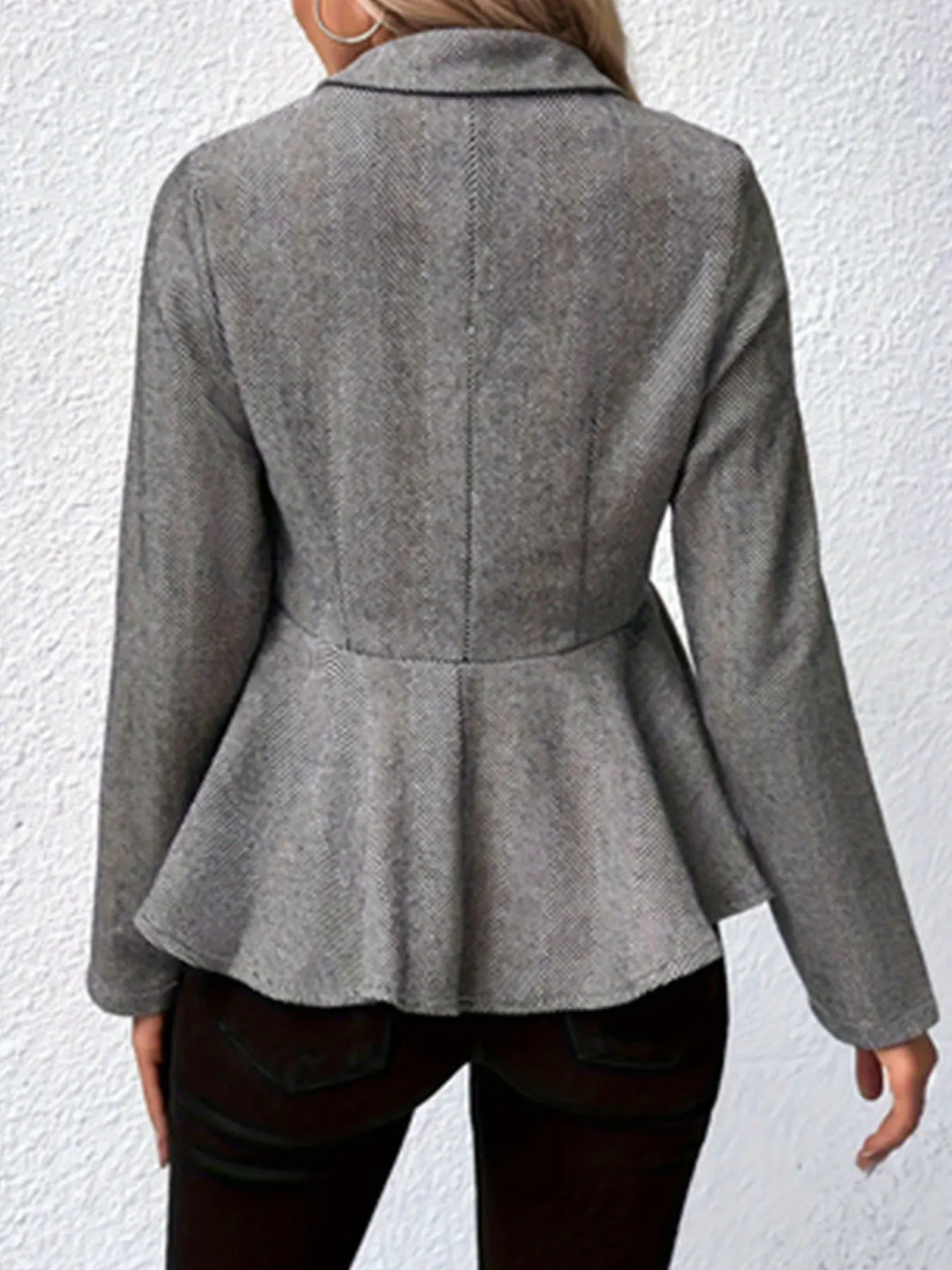 Gray back view trench coat with peplum flare and vertical panel seam.