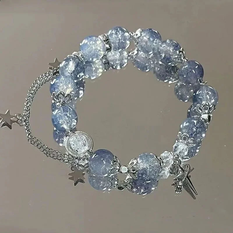 Blue crystal bead elastic bracelet with star charms and tassel dangle