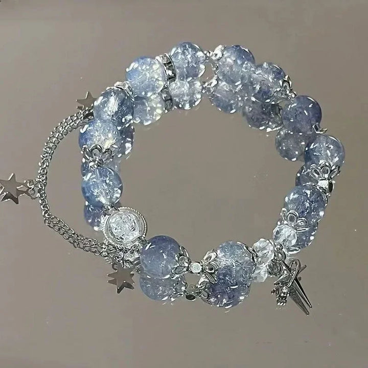 Blue crystal bead elastic bracelet with star charms and tassel dangle