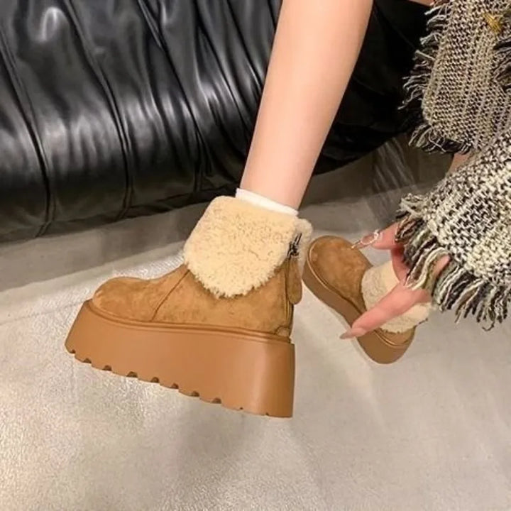 Women's tan suede platform boots with cream fuzzy trim and low, chunky sole