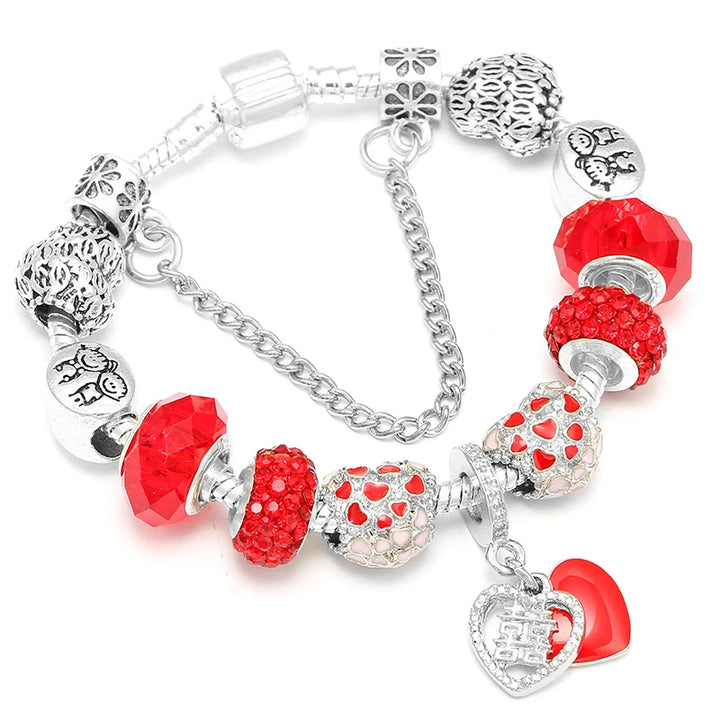 Red and pink crystal bead bracelet with heart charm and fox figure bead