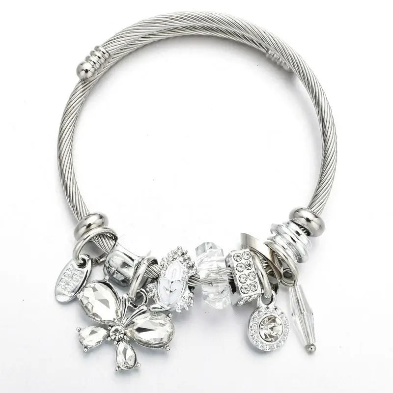 Stainless steel cuff bangle with clear crystal butterfly charms and dangles