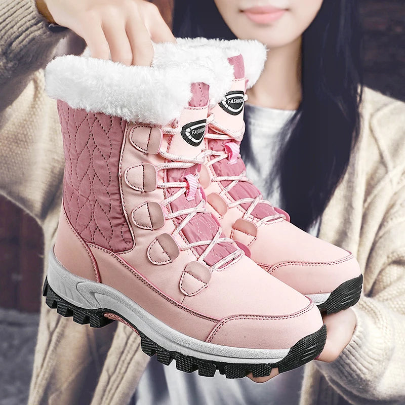Women's pink mid-calf lace-up snow boots with thick fleece lining and grippy outsole